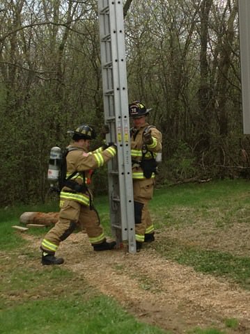 Firefighters with ladder