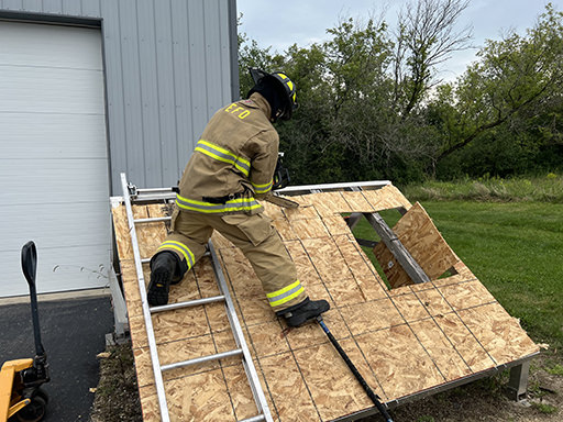fireman cutting roof